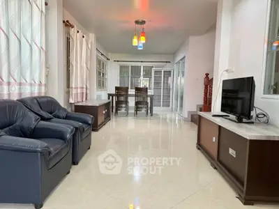 Spacious living room with modern furniture and elegant lighting