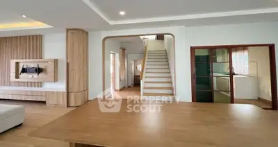 Spacious modern living room with wooden accents and open layout