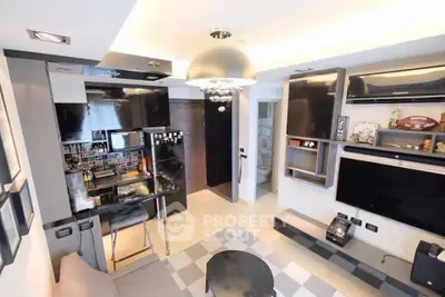 Modern living room with open kitchen, sleek design, and contemporary decor.