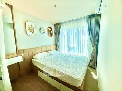 Bright and cozy bedroom with large window and modern decor
