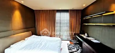 Luxurious bedroom with modern decor and large window view