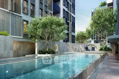 Luxurious modern apartment complex with stunning pool and lush greenery.