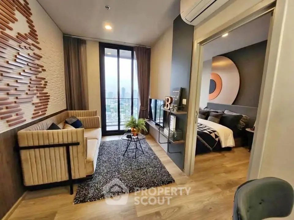 Modern apartment with stylish living room and cozy bedroom, featuring a stunning city view.
