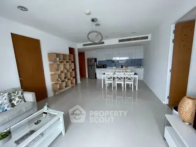 Spacious modern living room with open kitchen and elegant decor