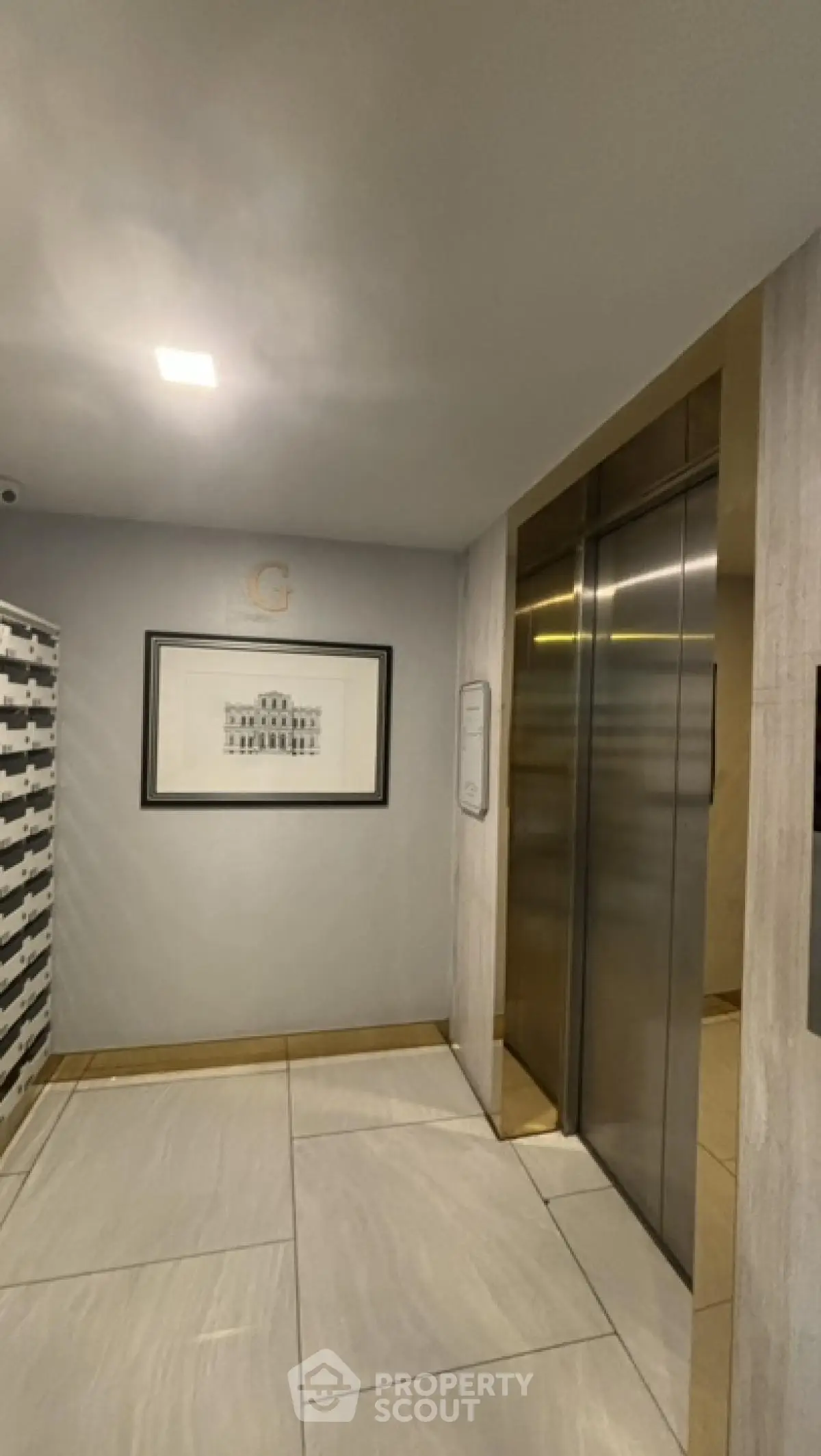 Modern elevator lobby with sleek design and elegant artwork