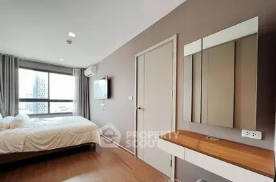 Modern bedroom with large window and stylish decor in urban apartment