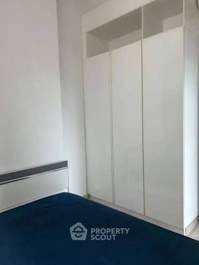 Modern bedroom with sleek wardrobe and minimalist design