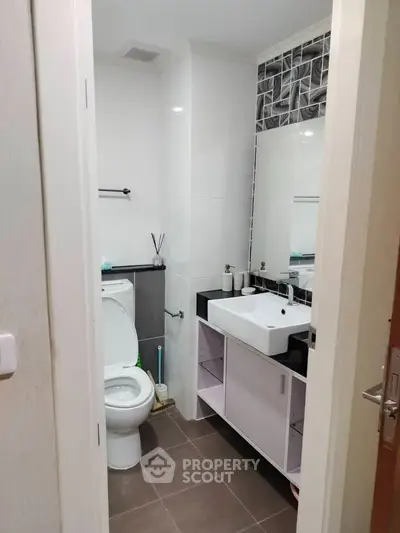 Modern bathroom with sleek fixtures and stylish tile accents