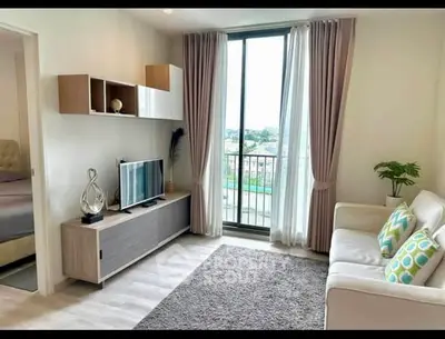 Modern living room with large window and stylish decor