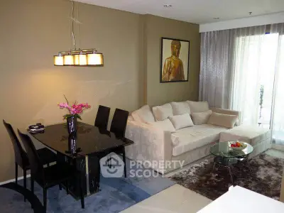 Modern living room with elegant dining area and cozy sofa, featuring stylish decor and natural light.