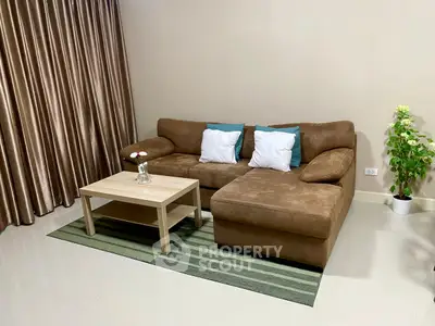 Cozy living room with brown sectional sofa and modern decor