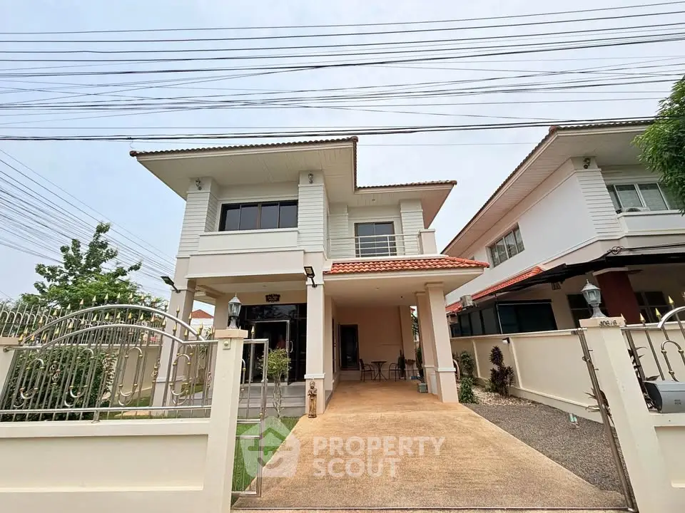 Charming two-story house with spacious driveway and modern exterior design.