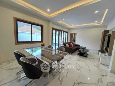 Spacious modern living room with elegant dining area and stylish decor