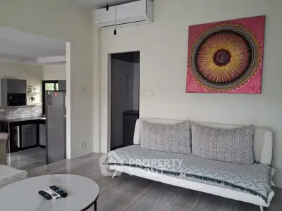 Modern living room with stylish decor and open kitchen layout