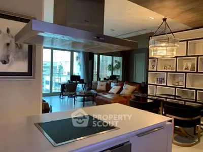 Luxurious open-plan living room with modern kitchen and elegant decor