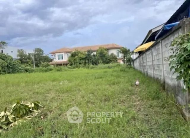 Spacious vacant land with lush greenery, perfect for building your dream home in a serene neighborhood.