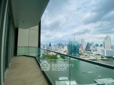 Stunning high-rise balcony with panoramic city and river views, perfect for urban living.