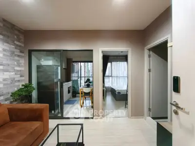 Modern apartment interior with open living room and kitchen, featuring stylish decor and natural light.