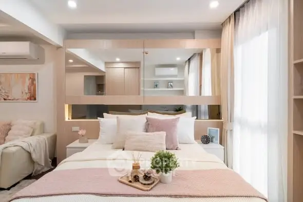 Luxurious bedroom with elegant decor and ample natural light