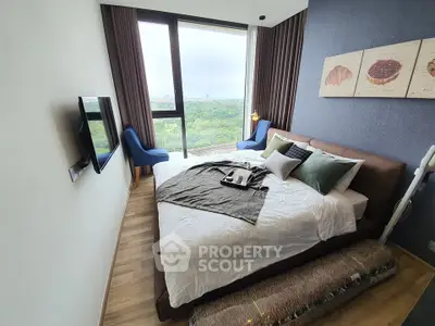 Luxurious bedroom with stunning park view and modern decor in high-rise apartment.