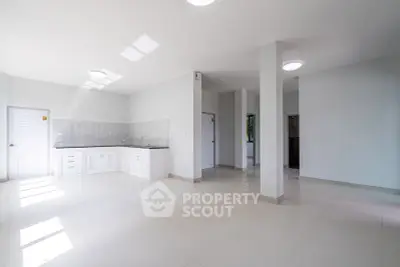 Spacious modern kitchen with open layout and sleek white cabinetry