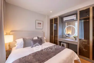 Luxurious bedroom with elegant decor and modern air conditioning unit, featuring a stylish vanity mirror.