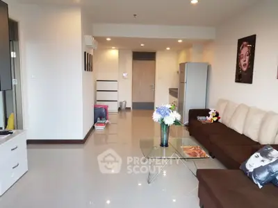Spacious modern living room with stylish decor and glass coffee table