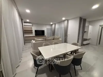 Spacious modern living room with elegant dining area and stylish furniture