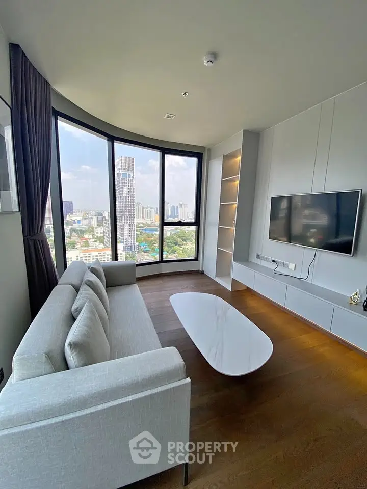 Modern living room with panoramic city view and sleek furnishings