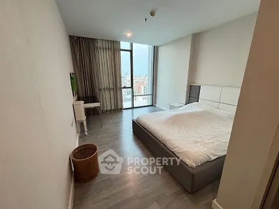 Spacious modern bedroom with city view and elegant decor