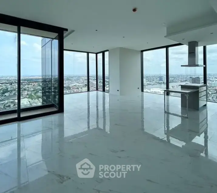 Luxurious corner unit with panoramic city views and open kitchen layout.