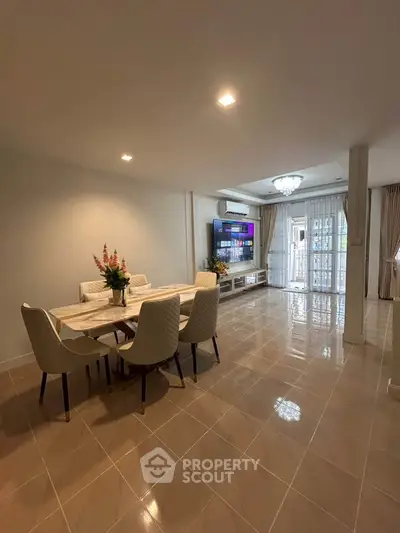 Spacious living room with elegant dining area and modern decor