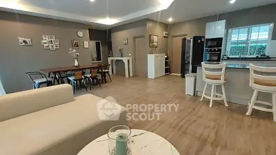 Spacious open-plan living room with modern kitchen and dining area