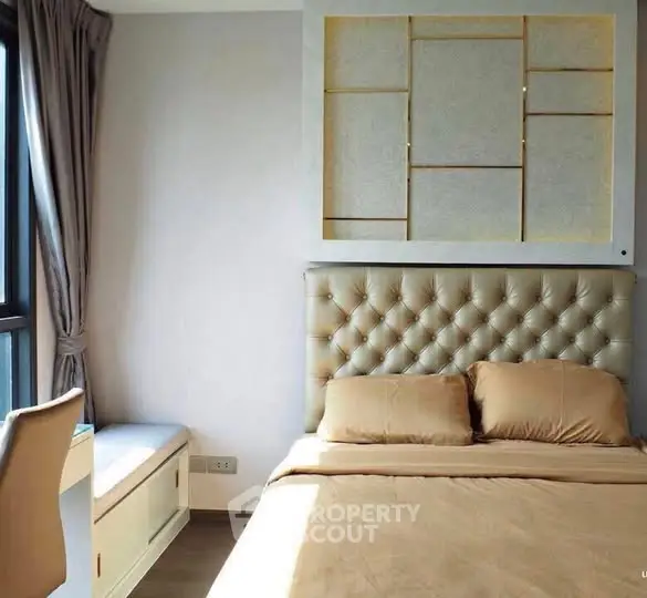 Elegant bedroom with tufted headboard and natural light