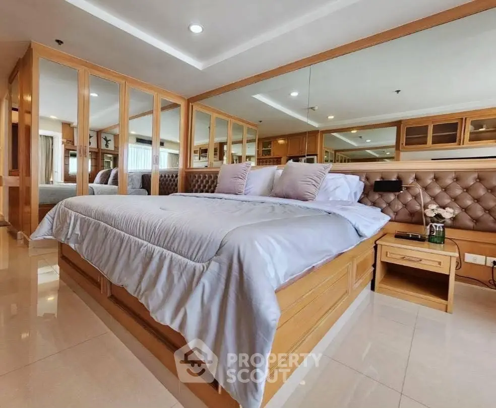 Luxurious bedroom with elegant wooden accents and plush bedding