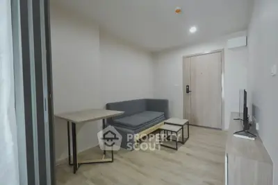 Modern minimalist living room with sleek furniture and wooden flooring