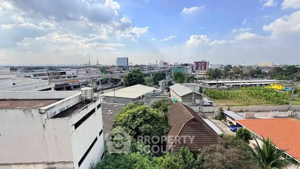 Stunning urban landscape view showcasing cityscape and greenery under a vibrant sky.