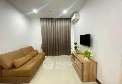 Modern living room with cozy brown sofa, wall-mounted TV, and stylish decor.