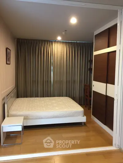Spacious bedroom with modern design and ample natural light