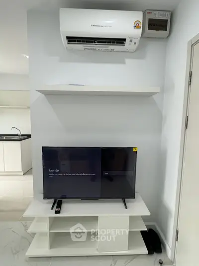 Modern living room with air conditioning and sleek TV setup