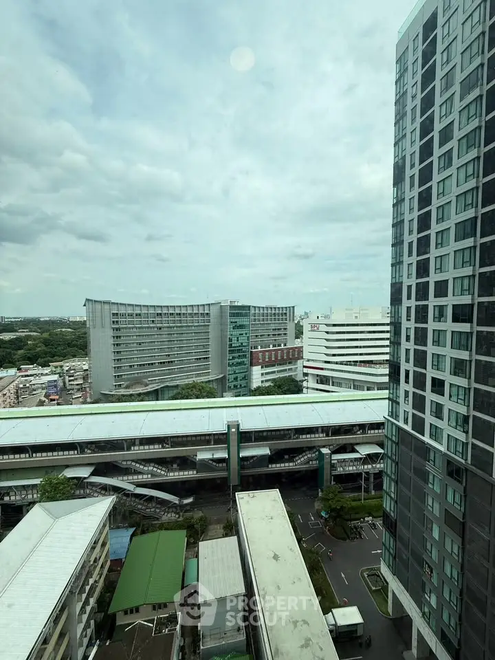Stunning cityscape view from high-rise building with modern architecture and urban skyline.