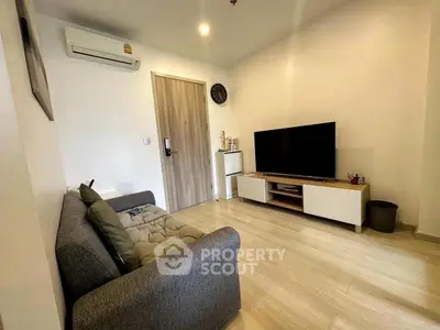 Cozy living room with modern decor and large TV setup