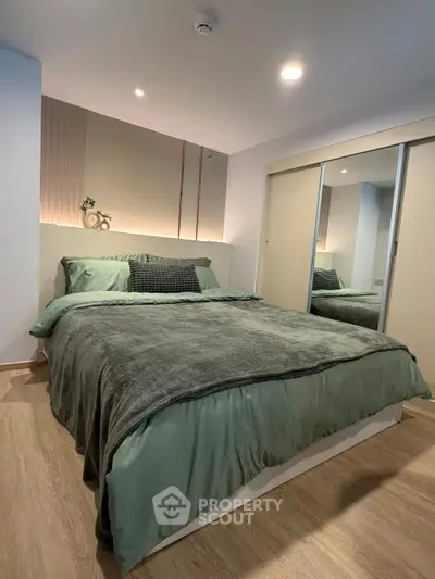 Modern bedroom with stylish decor and cozy bedding