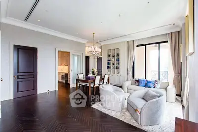Luxurious living room with elegant decor and spacious layout, featuring a dining area and large windows.