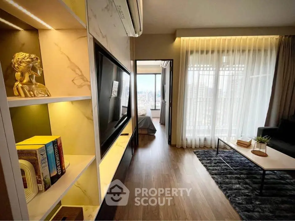 Modern living room with elegant decor and city view, featuring a cozy seating area and stylish shelving.