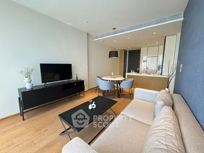 Modern living room with stylish furniture and open kitchen layout
