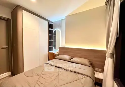 Modern bedroom with stylish lighting and sleek wardrobe design