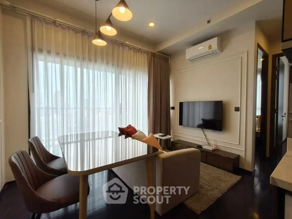 Modern living room with sleek furniture and large window view