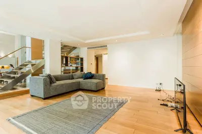 Spacious modern living room with sleek design and cozy sectional sofa