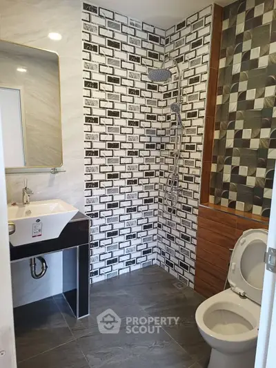 Modern bathroom with stylish tile design and sleek fixtures